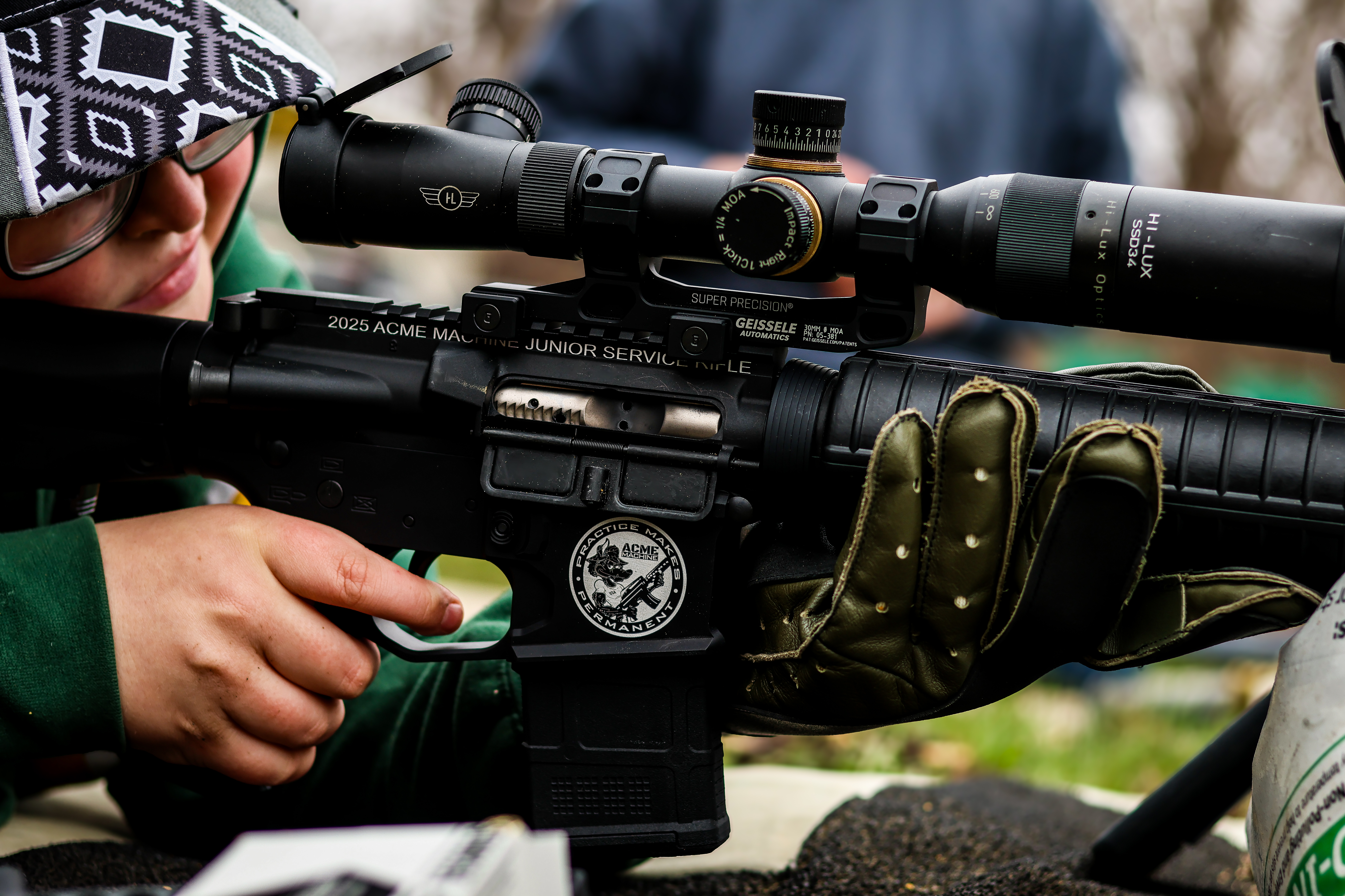 Junior marksman training and practicing on the firing line at the Iowa JHPRC with ACME Machine & ACME Rifle quality and custom design